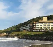 Hotel sitting on cliff over ocean