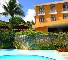 yellow building and bright blue pool