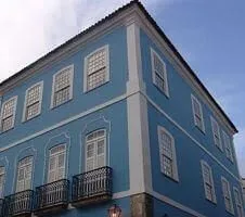 exterior of blue hotel building