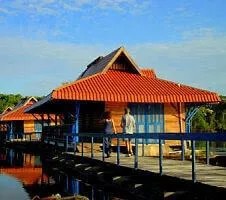 exterior of colorful hut on stilts