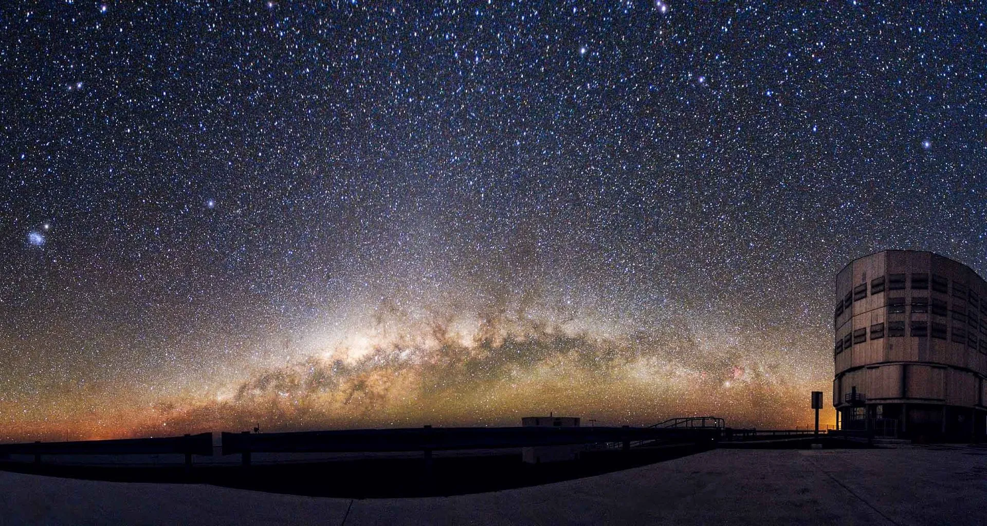 Building under vast starry sky