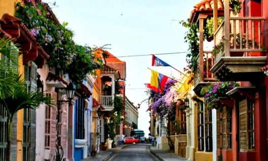 Walking down a colorful street in Cartagena on a tour of Colombia