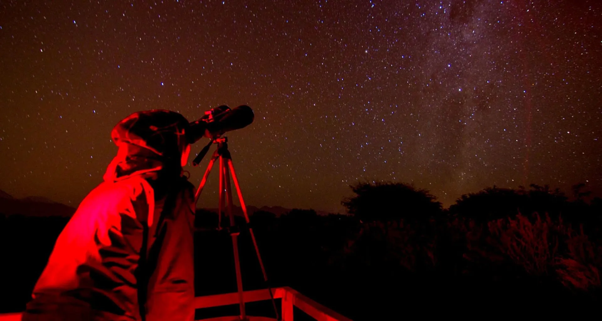 Person stargazing through telescope at Casa Atacama