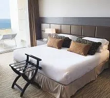 queen bed in chile hotel room