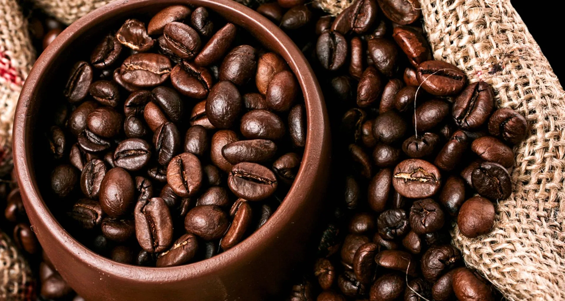 Close up coffee beans in a brown bowl