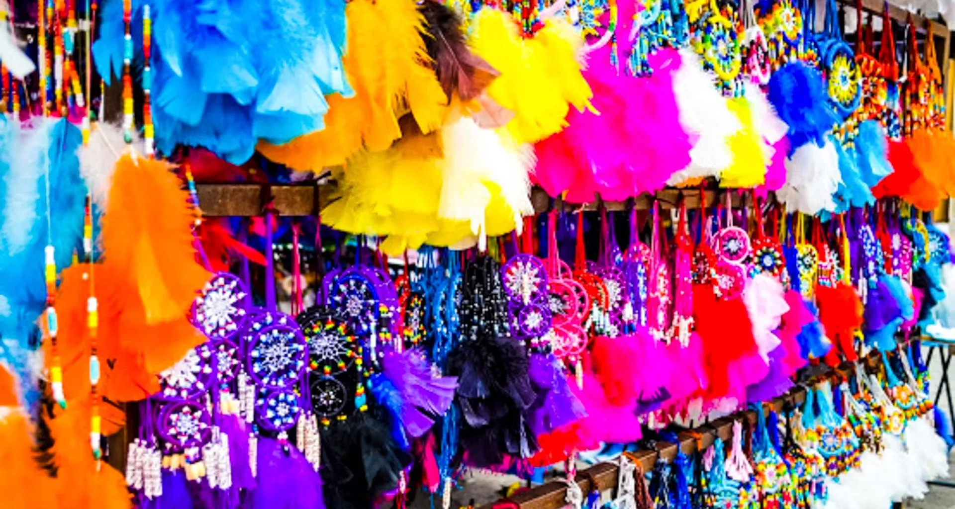 Colorful dreamcatchers hang in market display