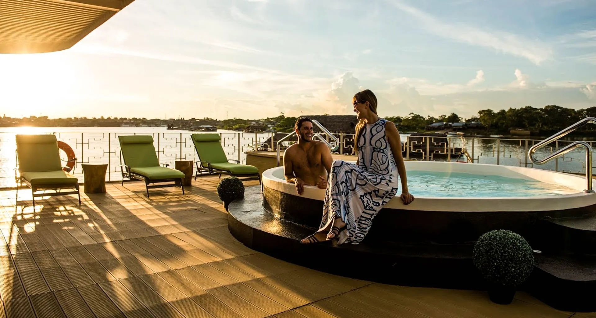 Travelers enjoy evening hot tub on Amazon cruise