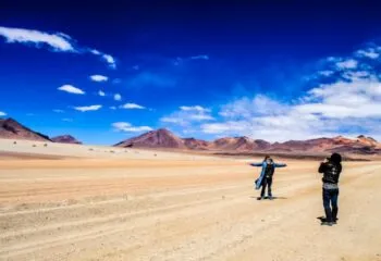 Travelers take photo in South America desert