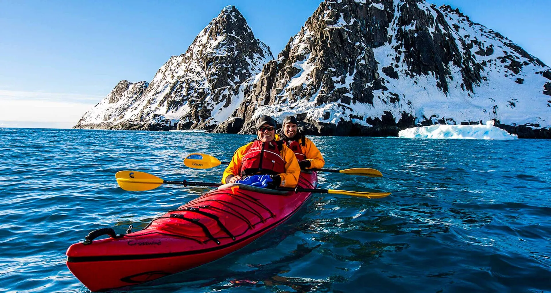 Travelers use double kayak in Antarctica waters