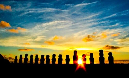 Sunset behind row of statues on Easter Island