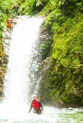 Travelers explore Ecuador waterfall