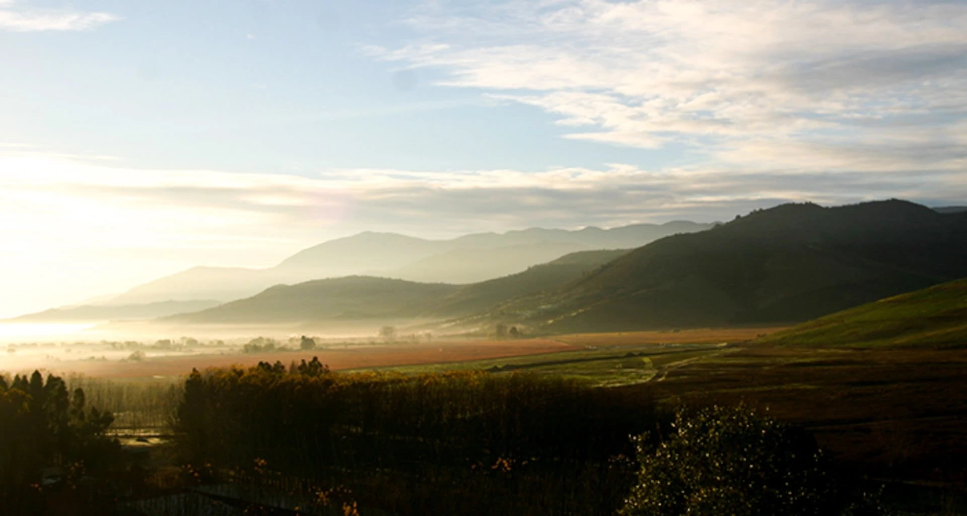 View across foggy South America valley