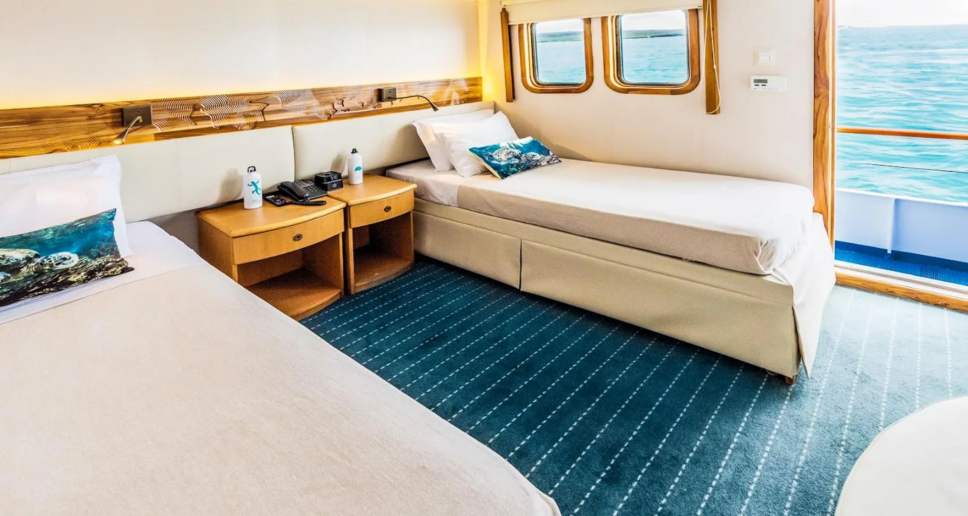 Twin beds in bedroom of Galapagos cruise ship