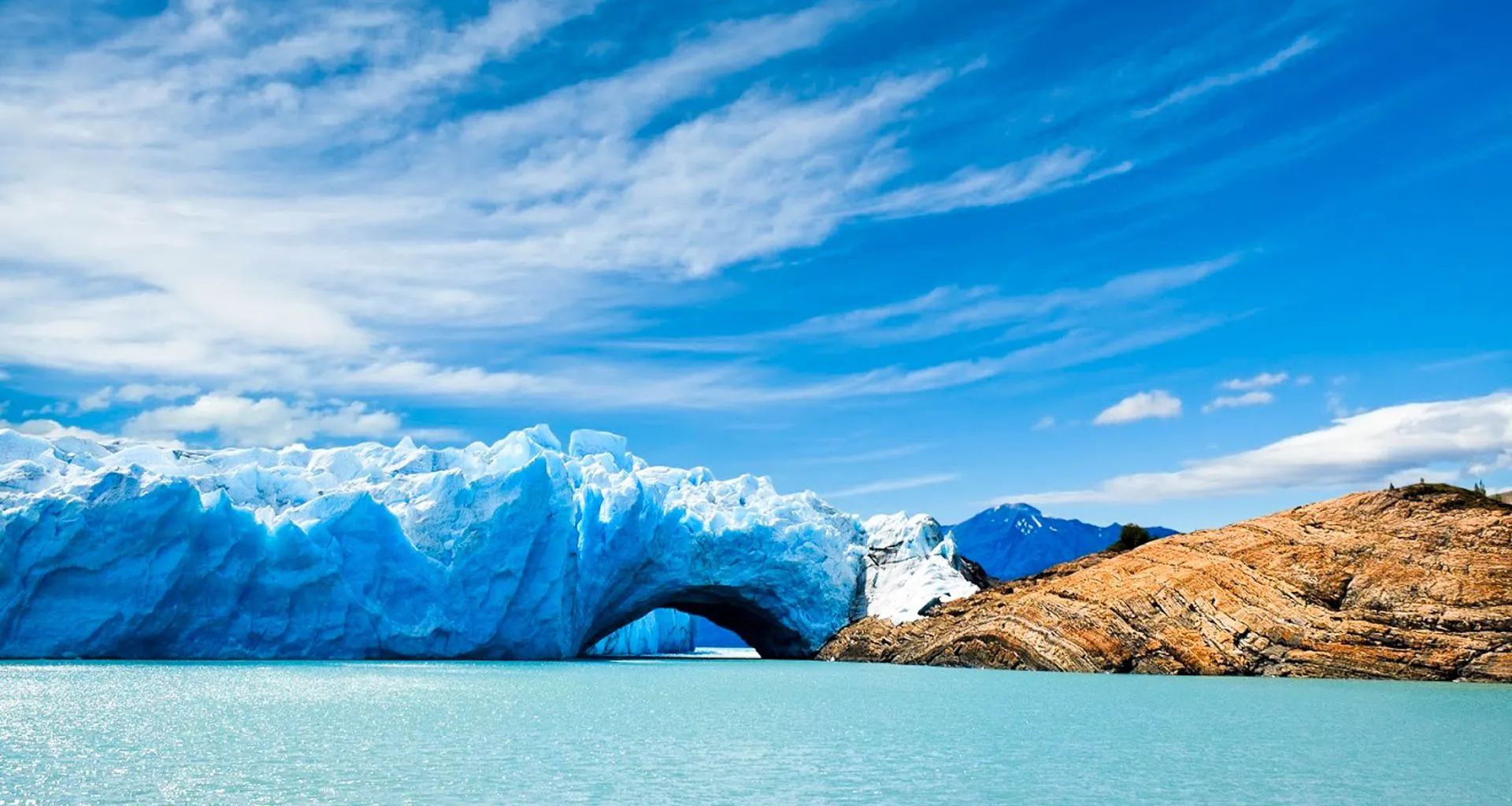 Arch in glacier near shore
