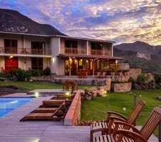 exterior of Gocta Lodge and pool in Kuelap at sunset