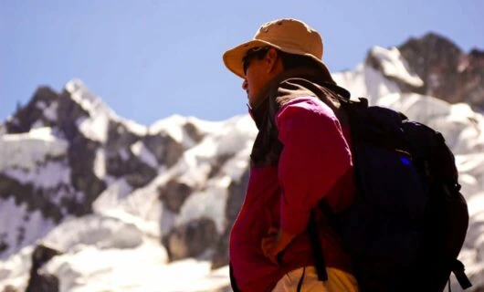 Low angle of hiker standing in South America mountains