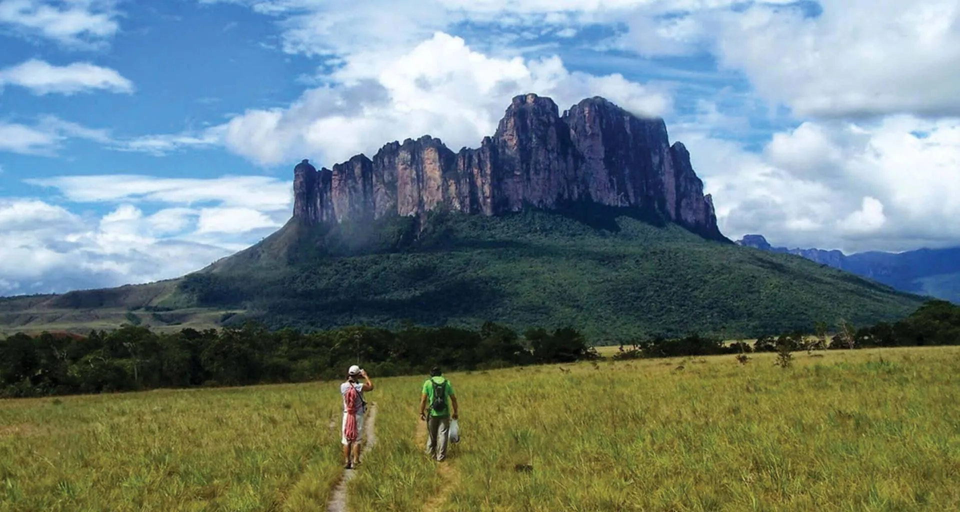 Two hikers near Mount Roraima in Venezuela