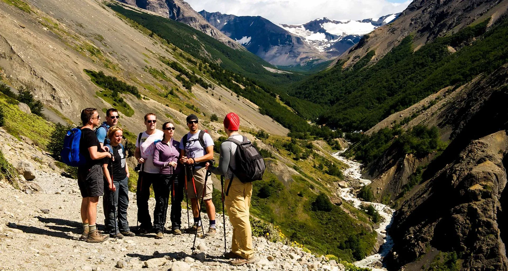 Hiking group pauses at end of valley