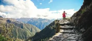 Person hiking cliffside section of Inca Trail