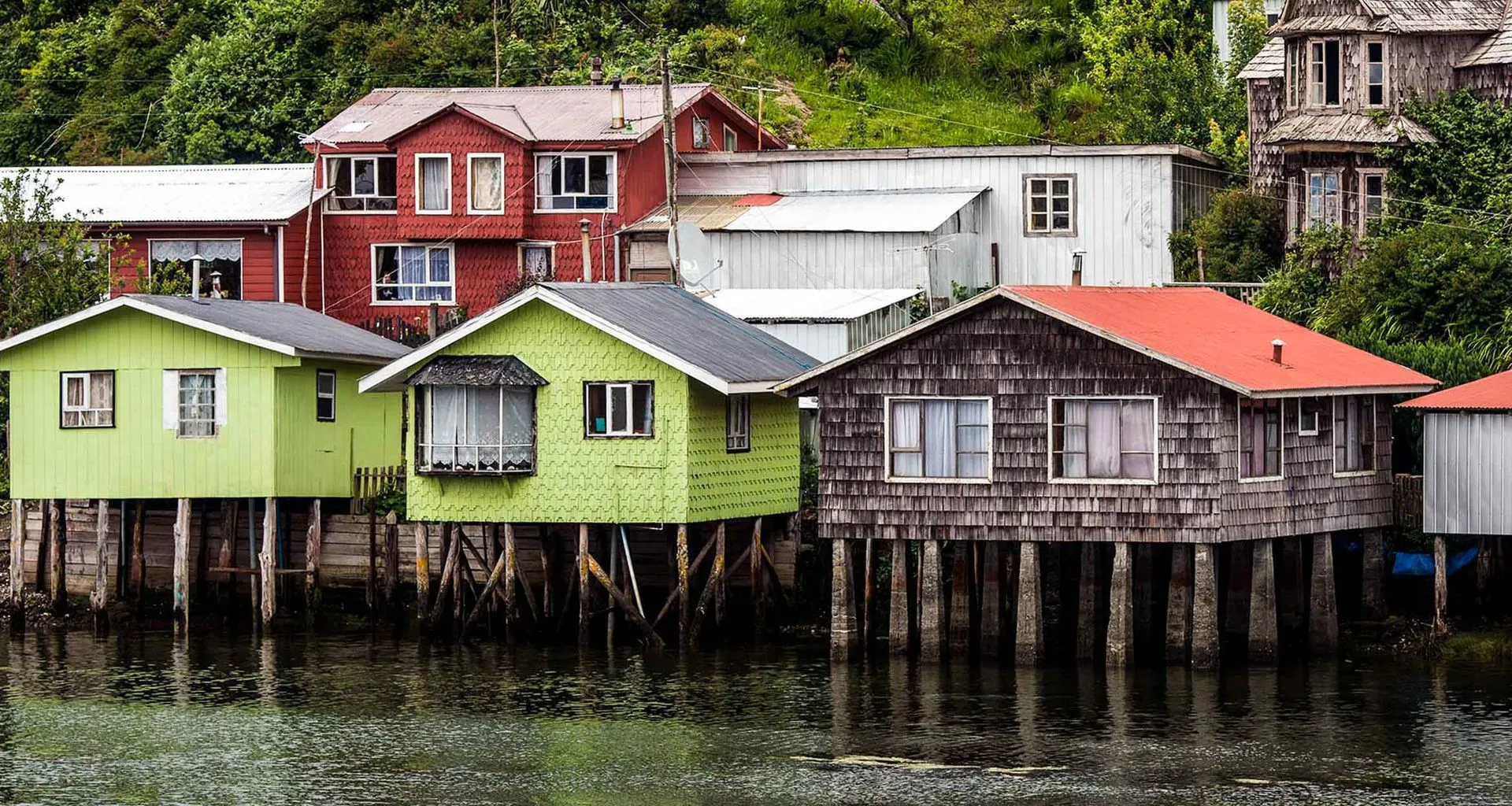 Houses on stilts on coast of island