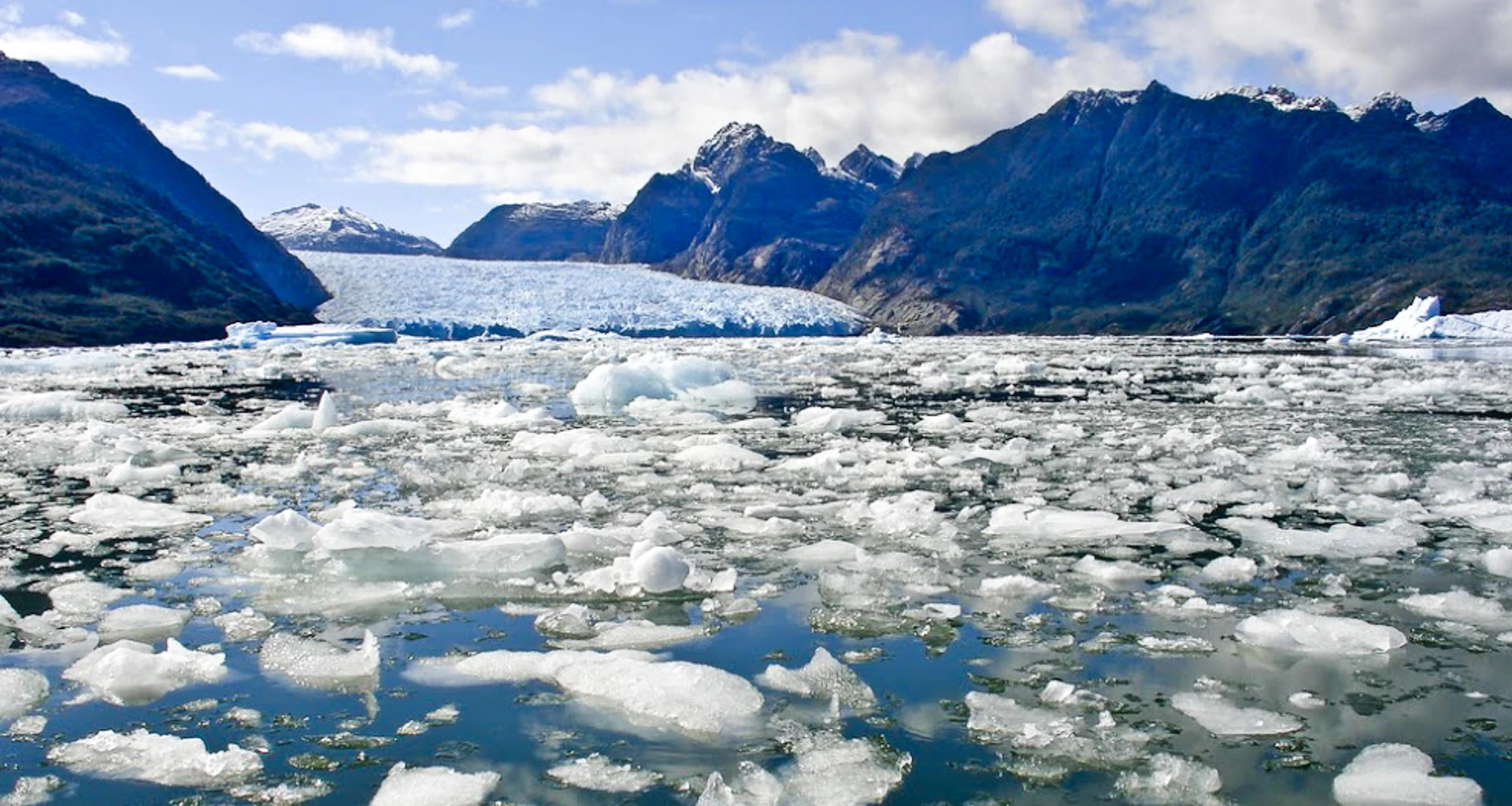 Broken up glacial ice near mountains