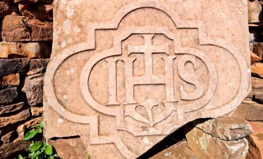 Jesuit symbol on red rock