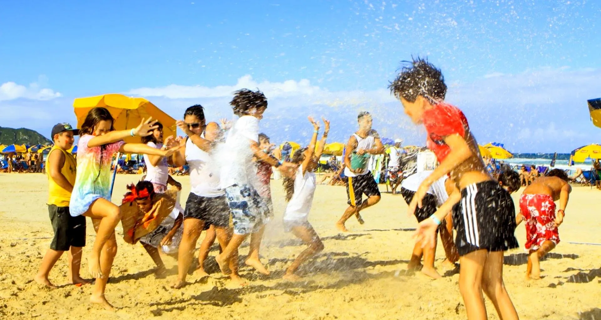 Kids play on beach in Brazil
