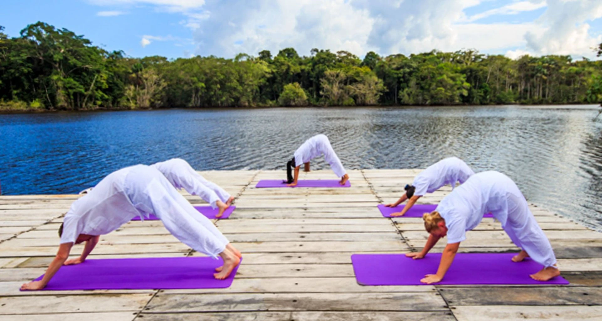 Yoga class on outdoor deck of La Selva Amazon Lodge