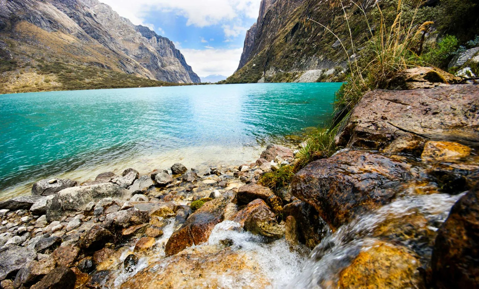 Waterfall into mountain laguna
