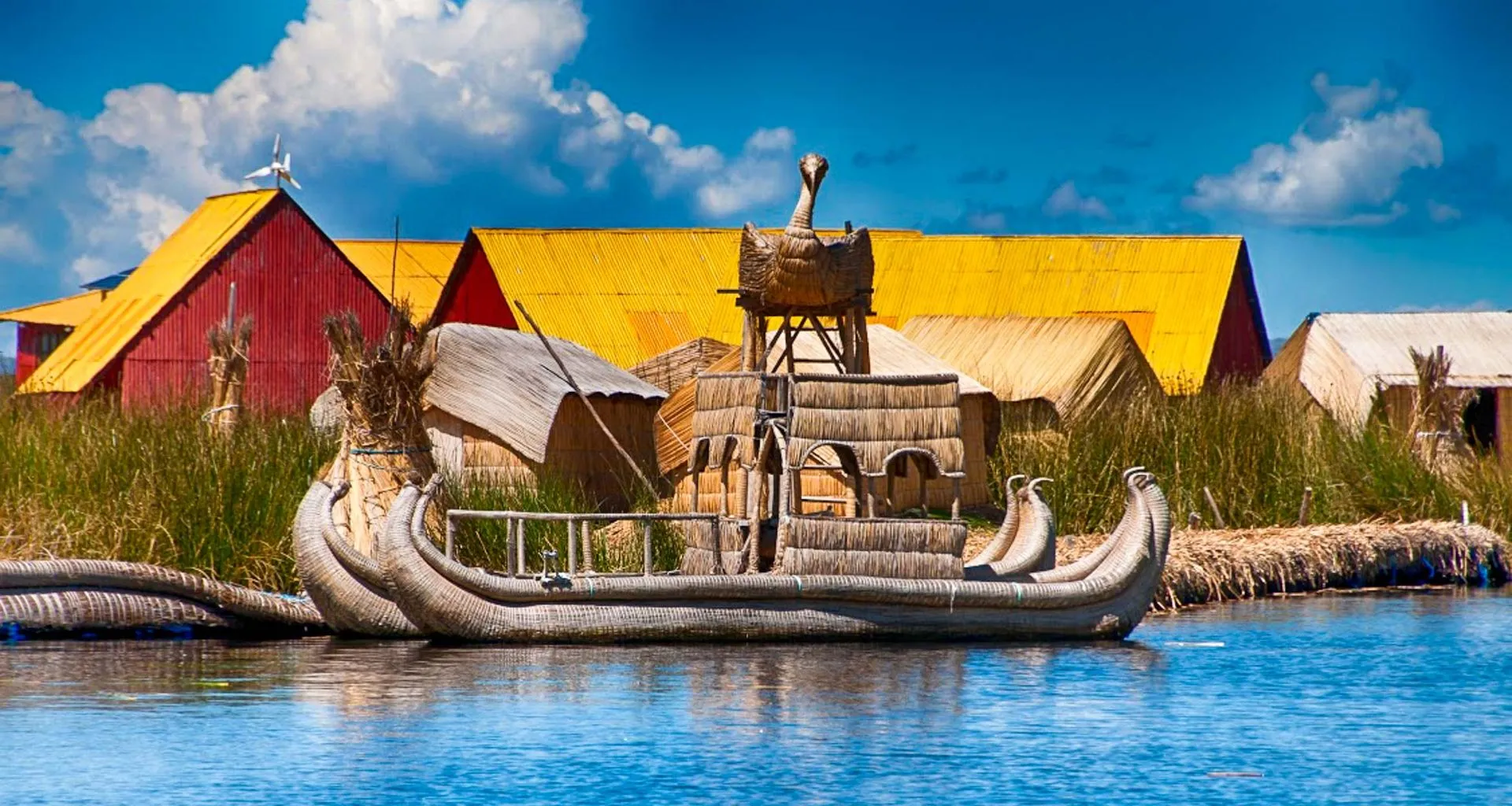 Straw Lake Titicaca boat sits near village