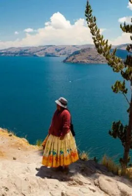 Two women stand near Lake Titicaca