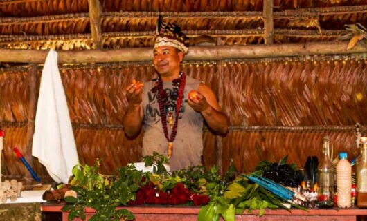 Man prepares food in lodge