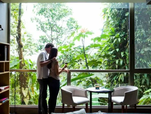 Visitors stand near window at Mashpi Lodge