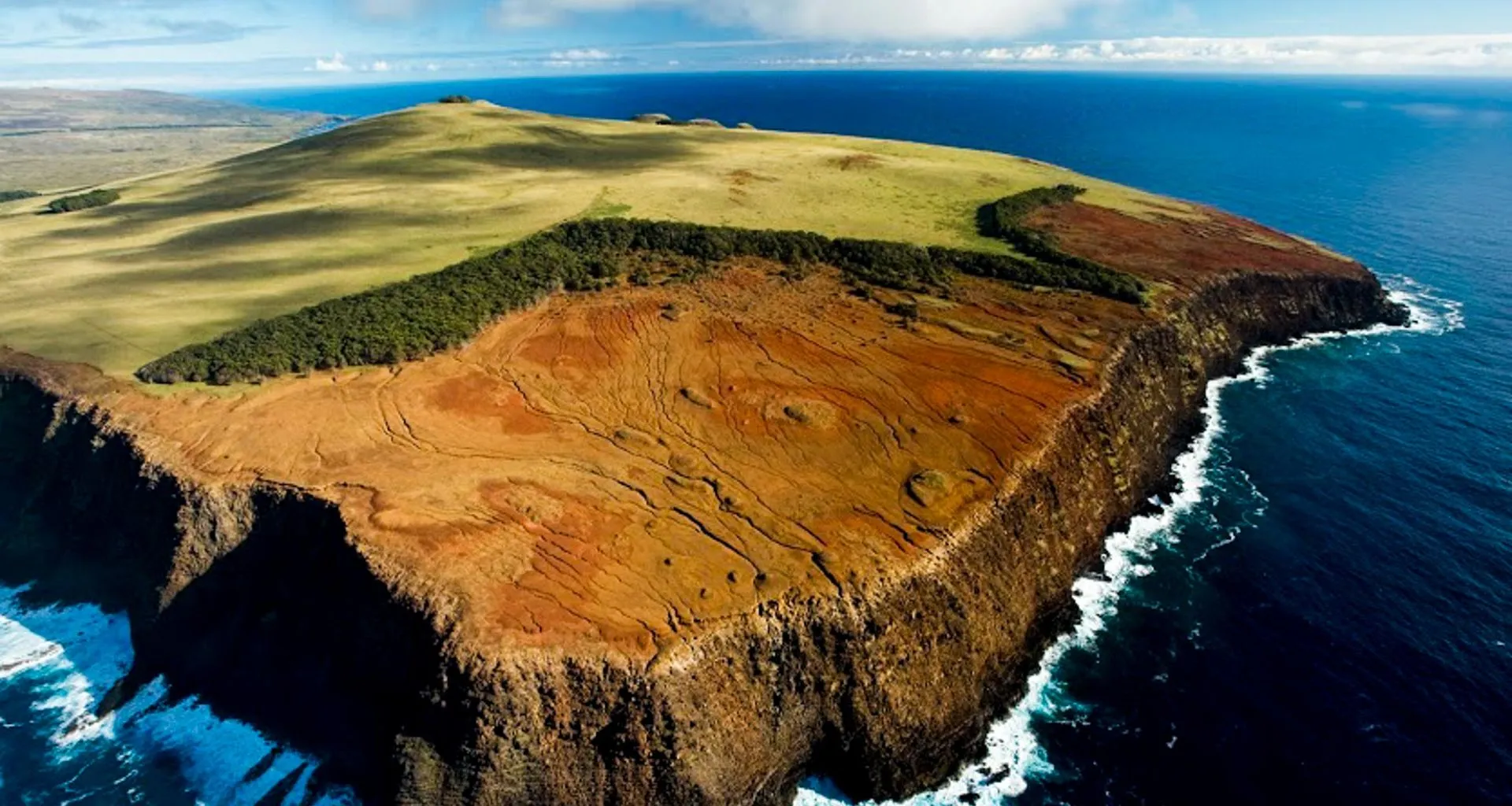 Aerial view of peninsula edged with cliff