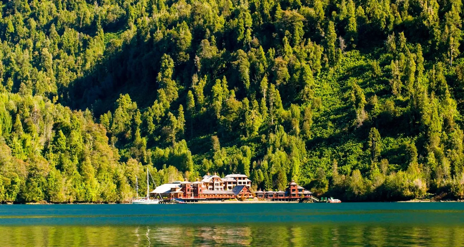Puyuhuapi Lodge and beach viewed across lake