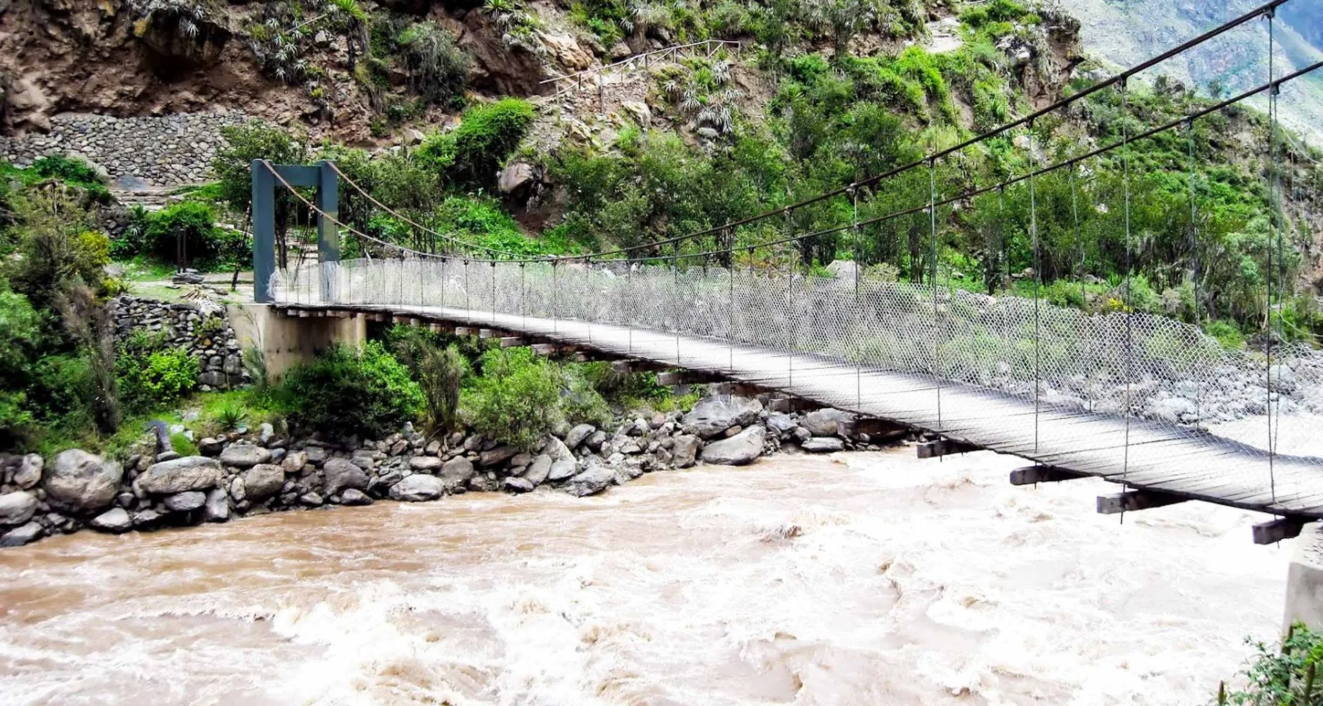 Suspension bridge trail over river