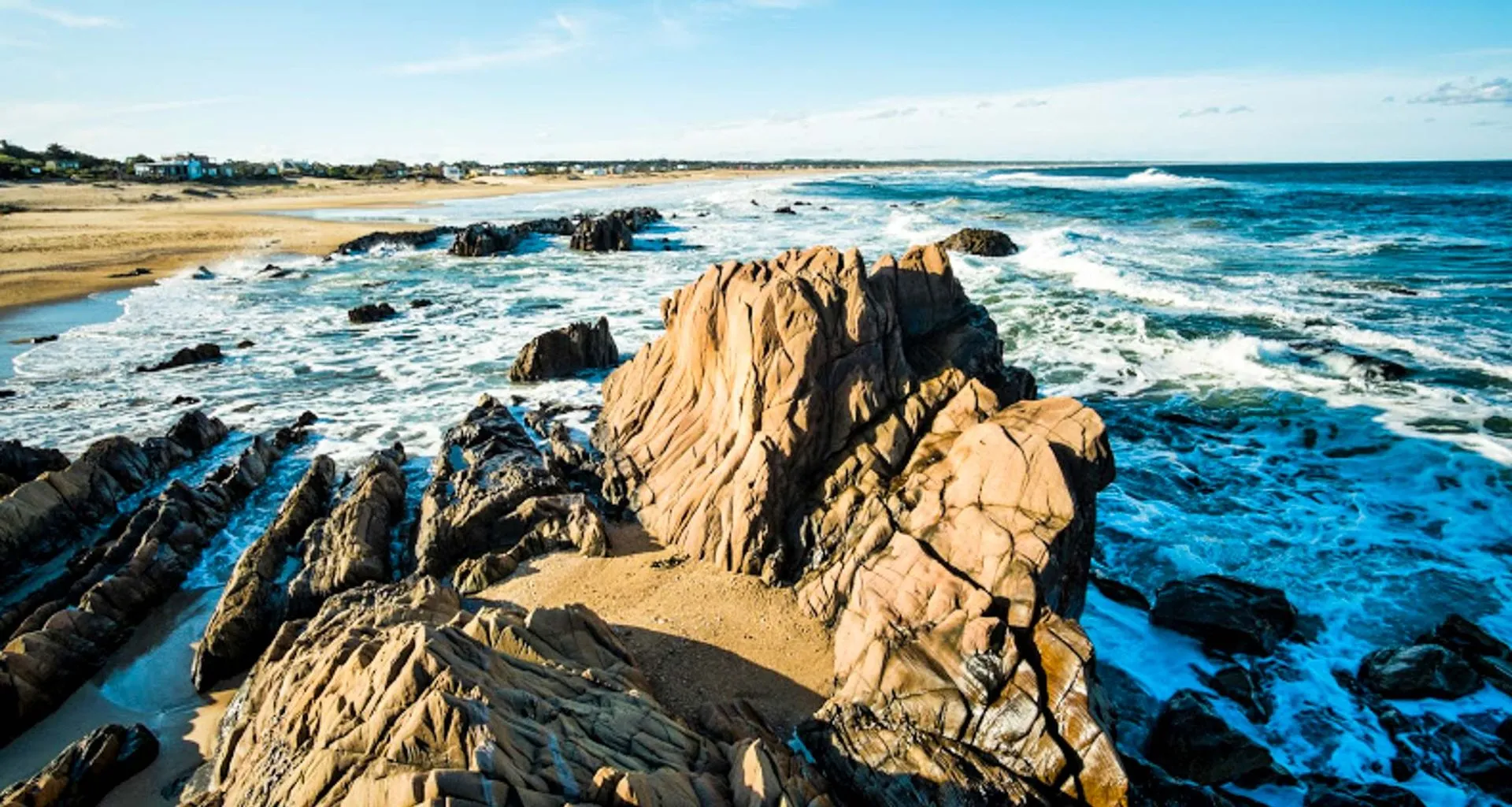 Ocean breaks over rocky beach