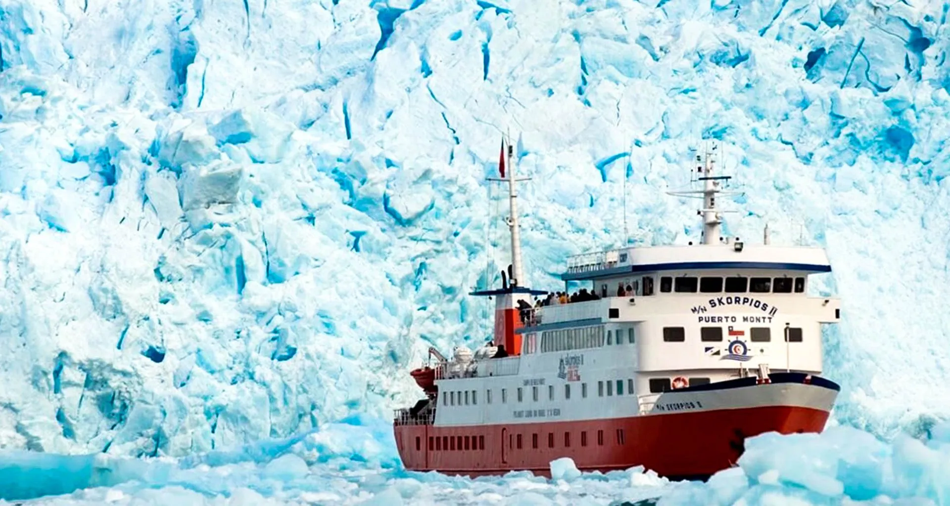 Skorpios cruise ship passes large glacier