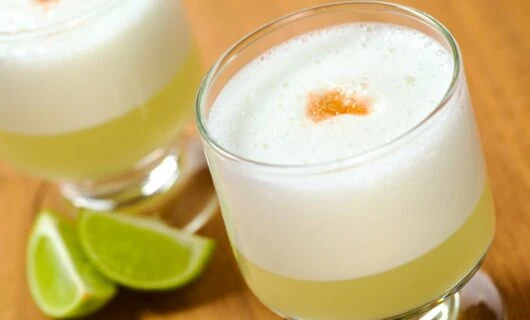 Close up of sour drink with slices of lime