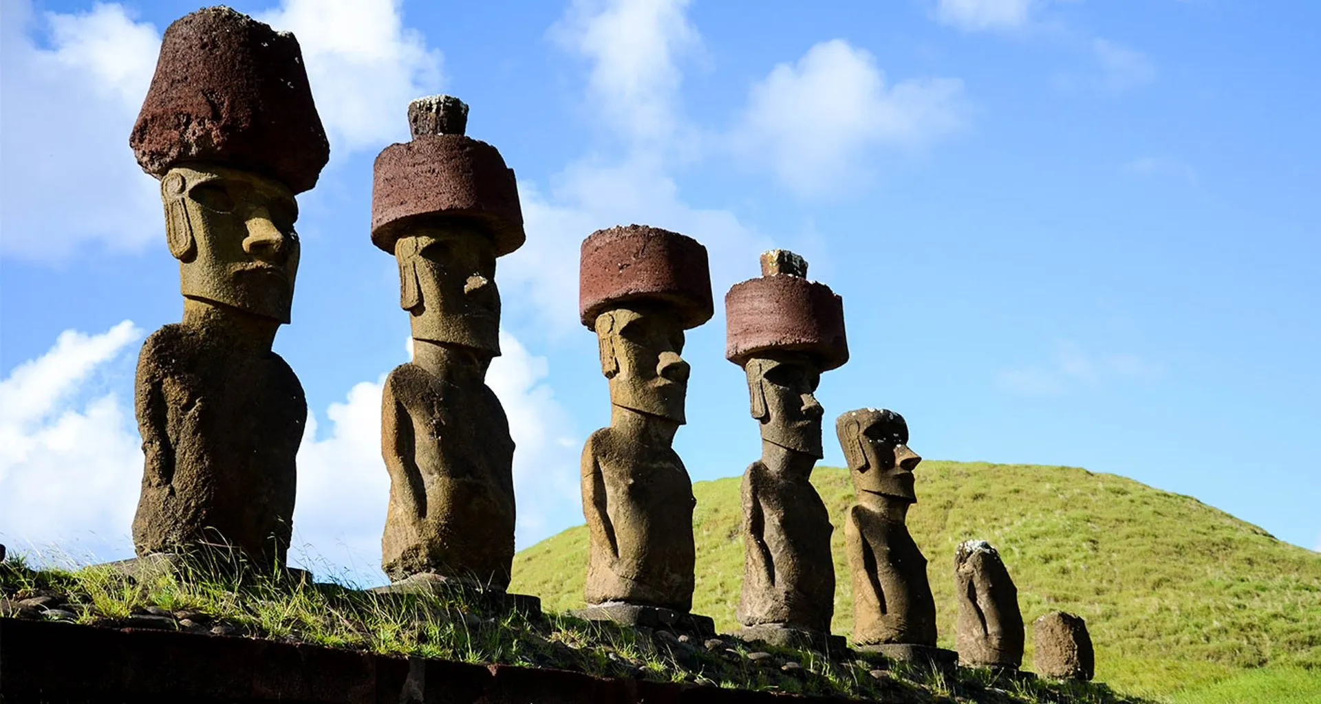Large statues in a row on a hill