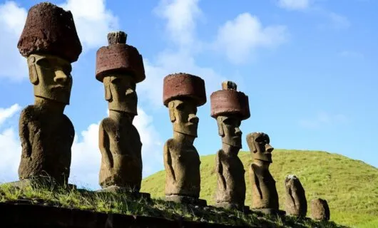 Large statues in a row on a hill