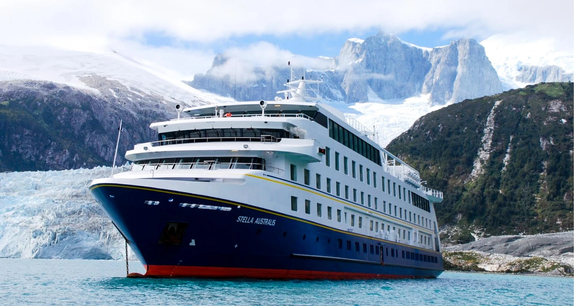 Stella Australis cruise ship in front of mountains