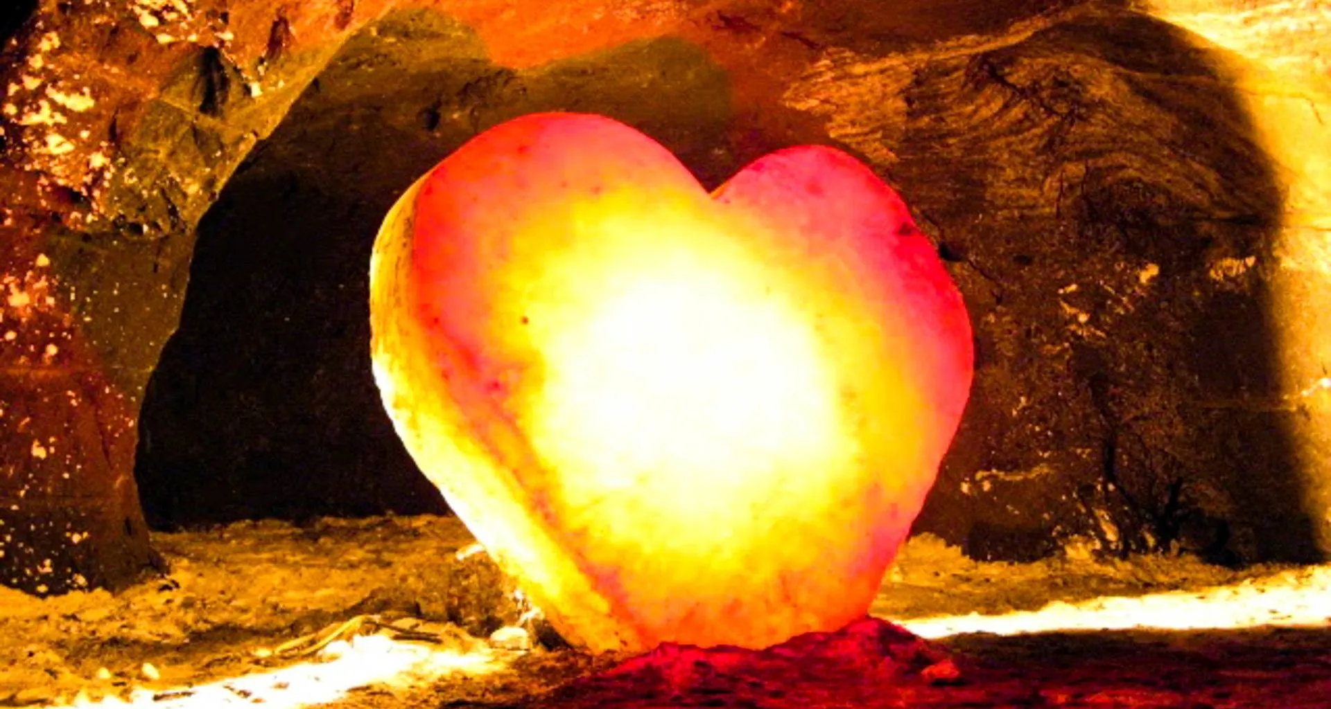 Glowing stone heart in cave