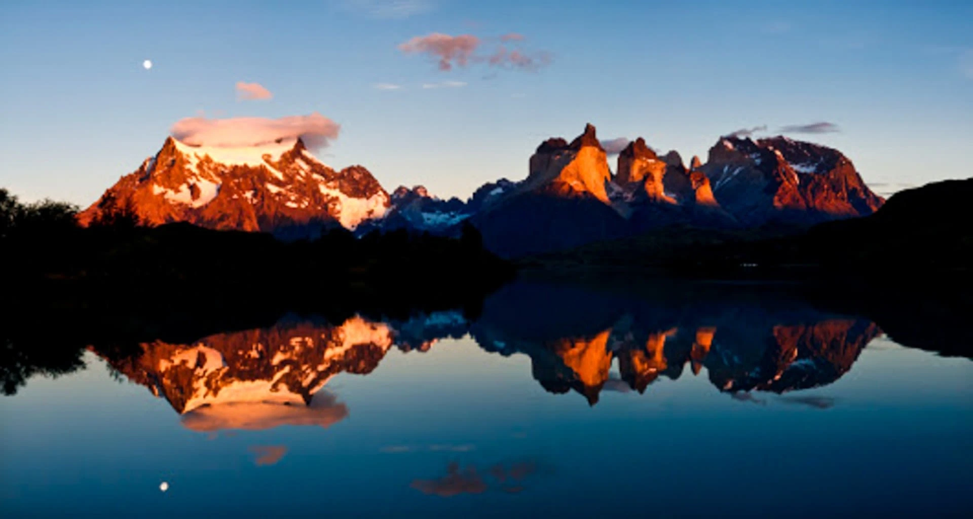 Sunset over Patagonia mountains and lake