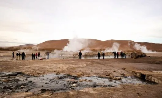 Tourists gather around Tatio Geysers