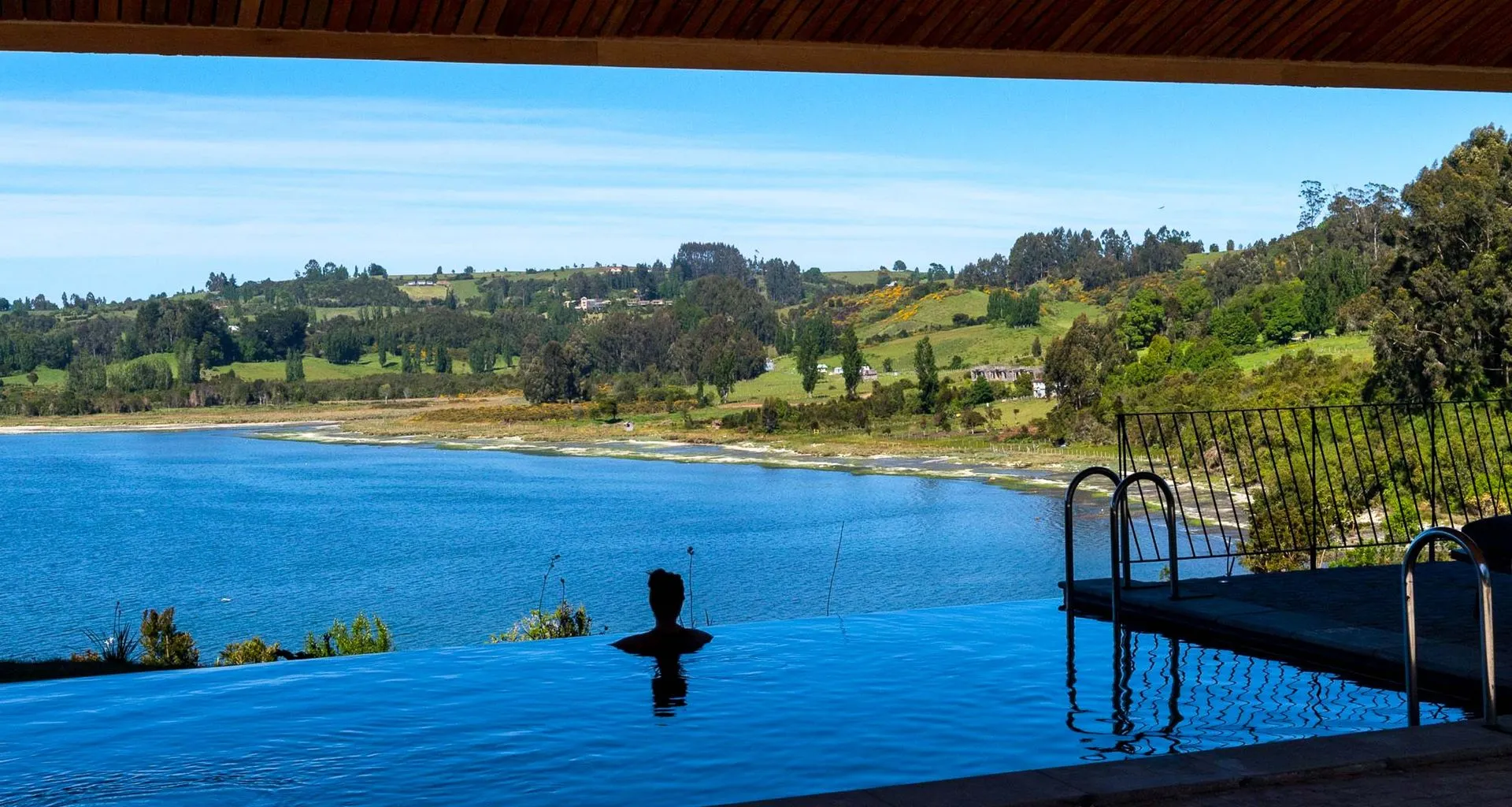 Person admires view from Tierra Patagonia Hotel pool