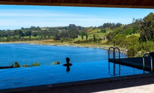 Person admires view from Tierra Patagonia Hotel pool