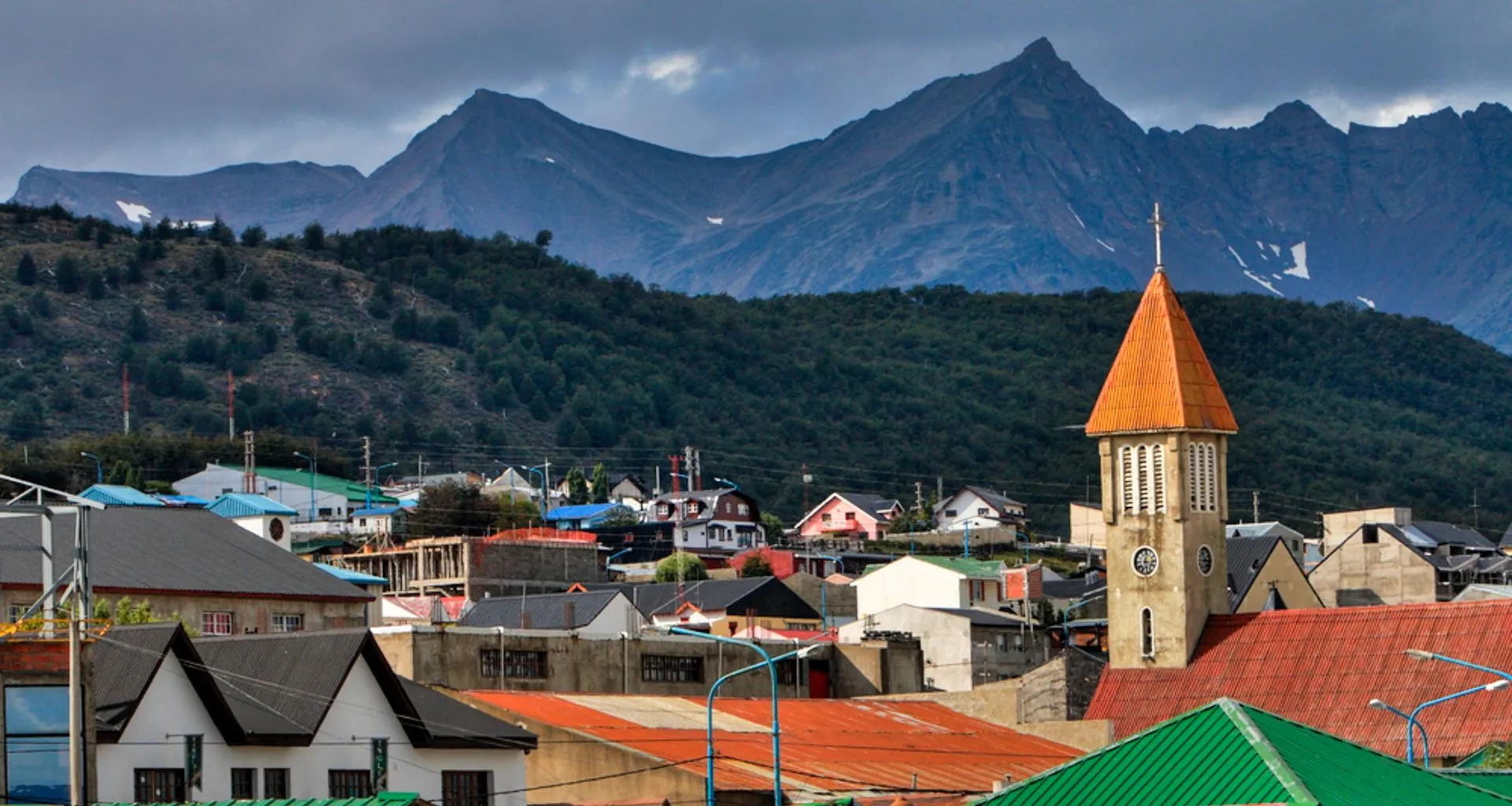 Roofs of town in front of mountains