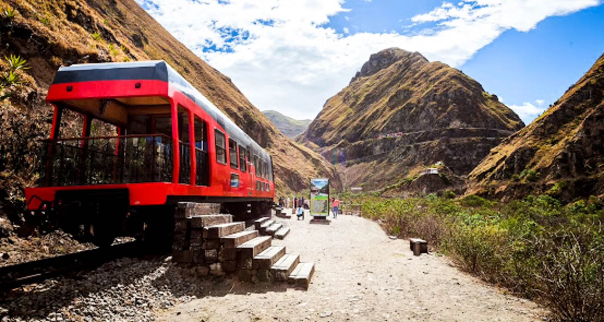 Red train car with steps leading inside