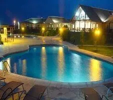 pool outside of lodge at night